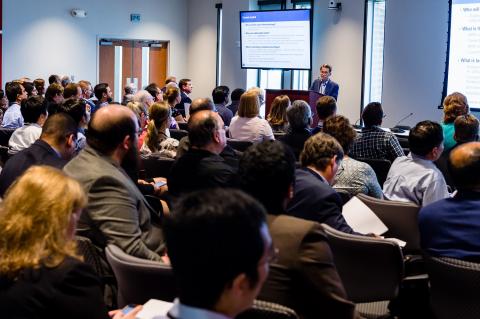 Attendees in an auditorium at the 2019 Tech Showcase.