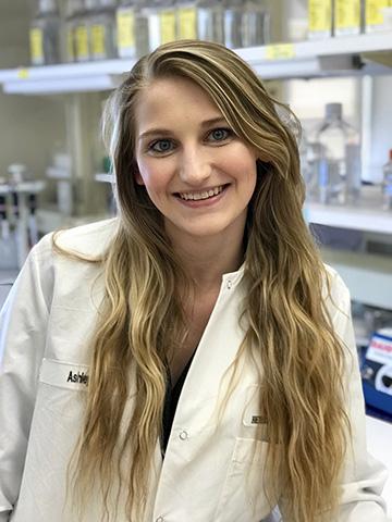 Photo of former intern Ashley Babyak in an NIH laboratory