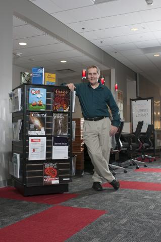 Man standing in resource center.