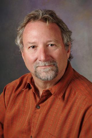 Studio portrait of Mickey Williams.