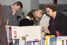 People searching through books