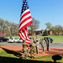 Soldiers saluting the flag. 