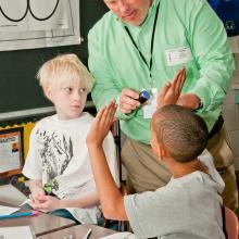 Gary Krauss working with elementary school students