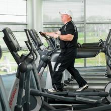 Shawn Kelly exercises on an elliptical machine at the ATRF