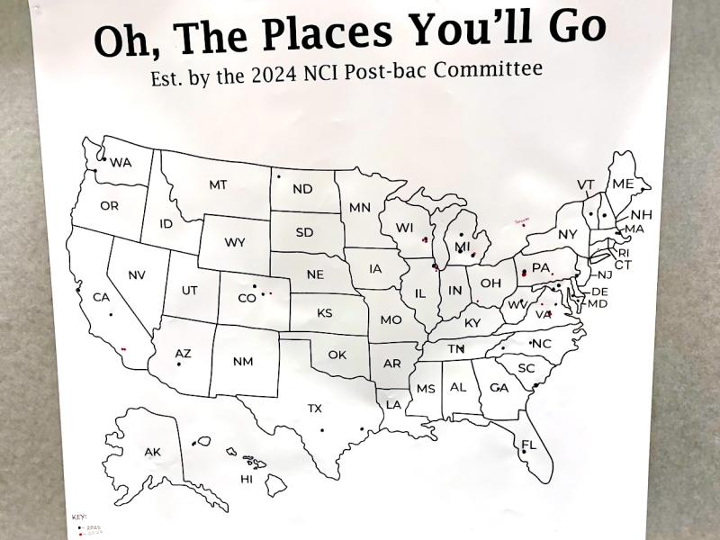 The map at the Fellows Sendoff Potluck was titled “Oh, The Places You’ll Go,” referring to the Dr. Seuss poem of the same name and reminding the fellows this marks the beginning of their journey. The dark blue dots show where 2025 fellows went after their fellowships at NCI Frederick; the magenta dots show where the 2026 fellows are going next. (Image credit: Karolina Wilk)