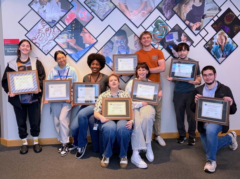 The Frederick Postbac Committee members, including those who are concluding their fellowships as well as those who will continue next year, pose with their certificates. Fellows pictured, left to right: Allison Kende, Aleah Nguyen, Alana Thomas (co-chair), Olga Drozdovitch (co-chair), Sarah Harrison, Thomas Abney-Lidahl, Dylan Rothbort, and Noah Salewski. (Image credit: Karolina Wilk)