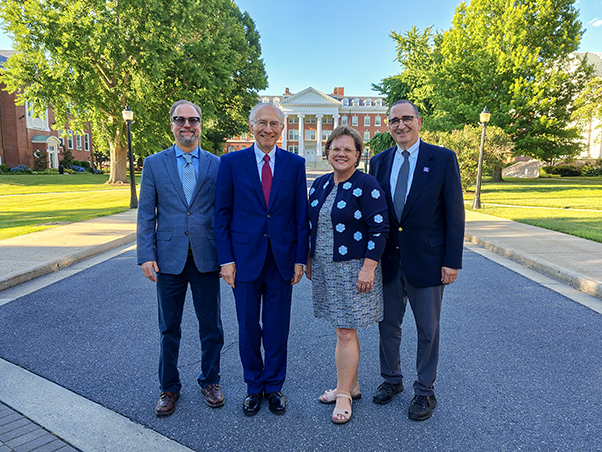 Contributors and leaders pose with keynote speaker Harvey Fineberg, M.D., Ph.D. (center-left). From left: Nathan Coussens, Ph.D., planning committee member and director of FNLCR’s Molecular Pharmacology Laboratory; Fineberg; Debbie Ricker, Ph.D., president of Hood College; and Jay Schnitzer, M.D., Ph.D., director of FNLCR and president of Leidos Biomedical Research, Inc. (Photo by Samuel Lopez)