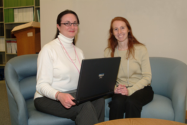 Tracie Frederick (left) and Marci Brandenburg (right) were the first two librarians to operate the Laptop Librarian Program upon its launch in 2008. (Photo from the SPGM archive.)