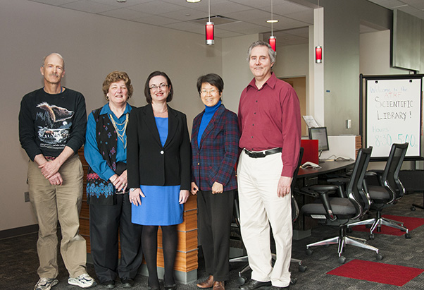 The Scientific Library’s branch in the Advanced Technology Research Facility opened in 2012, shortly after the building was completed. Additional shelves and resources would be added over the next 12 years. Pictured here, from left: Steve Jones, Robin Meckley, Tracie Frederick, Hungyune Chao, and Alan Doss. (Photo from the SPGM archive.)