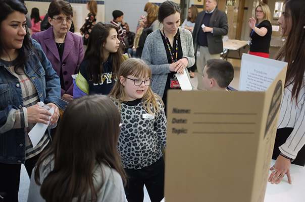 In 2019, NCI Frederick student interns and peers in the community founded a science club at a local elementary school, culminating in a much-celebrated science fair. Rich covered it and captured the bustle around this participant’s project.